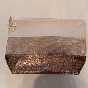 Clarins clutch, cream and copper